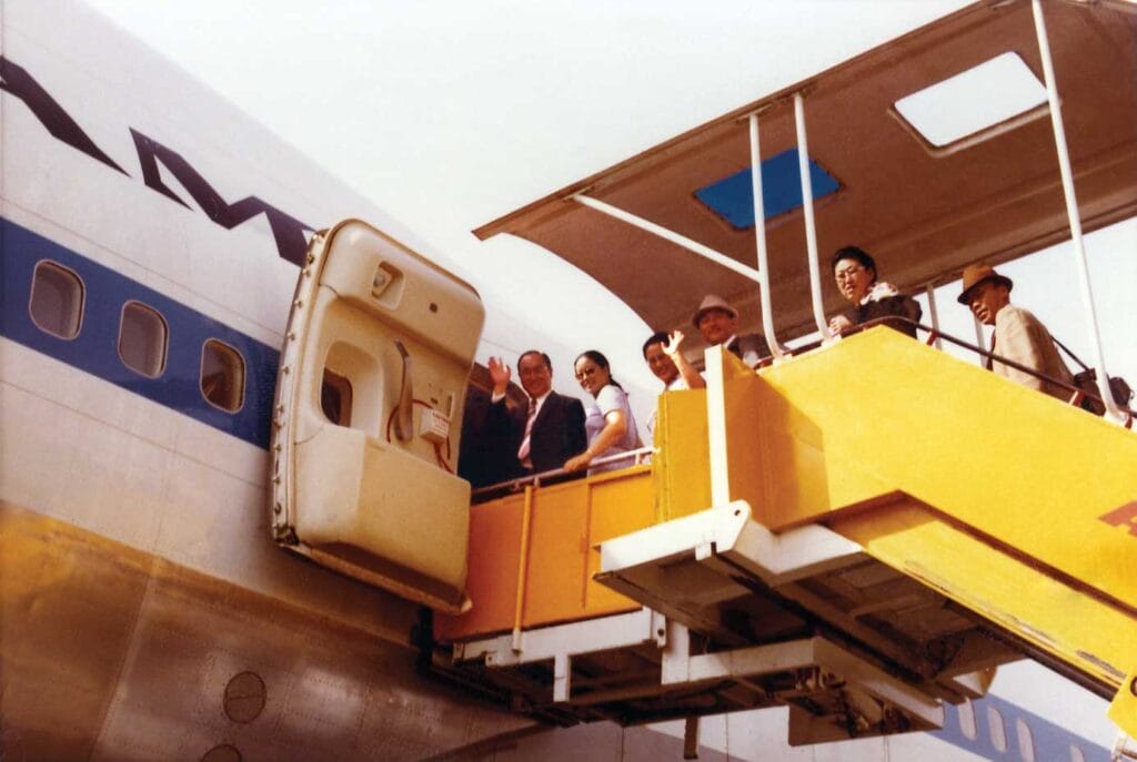 True Parents and entourage boarding the plane at Delhi, India, en route to Bangkok, Thailand, April 17, 1972