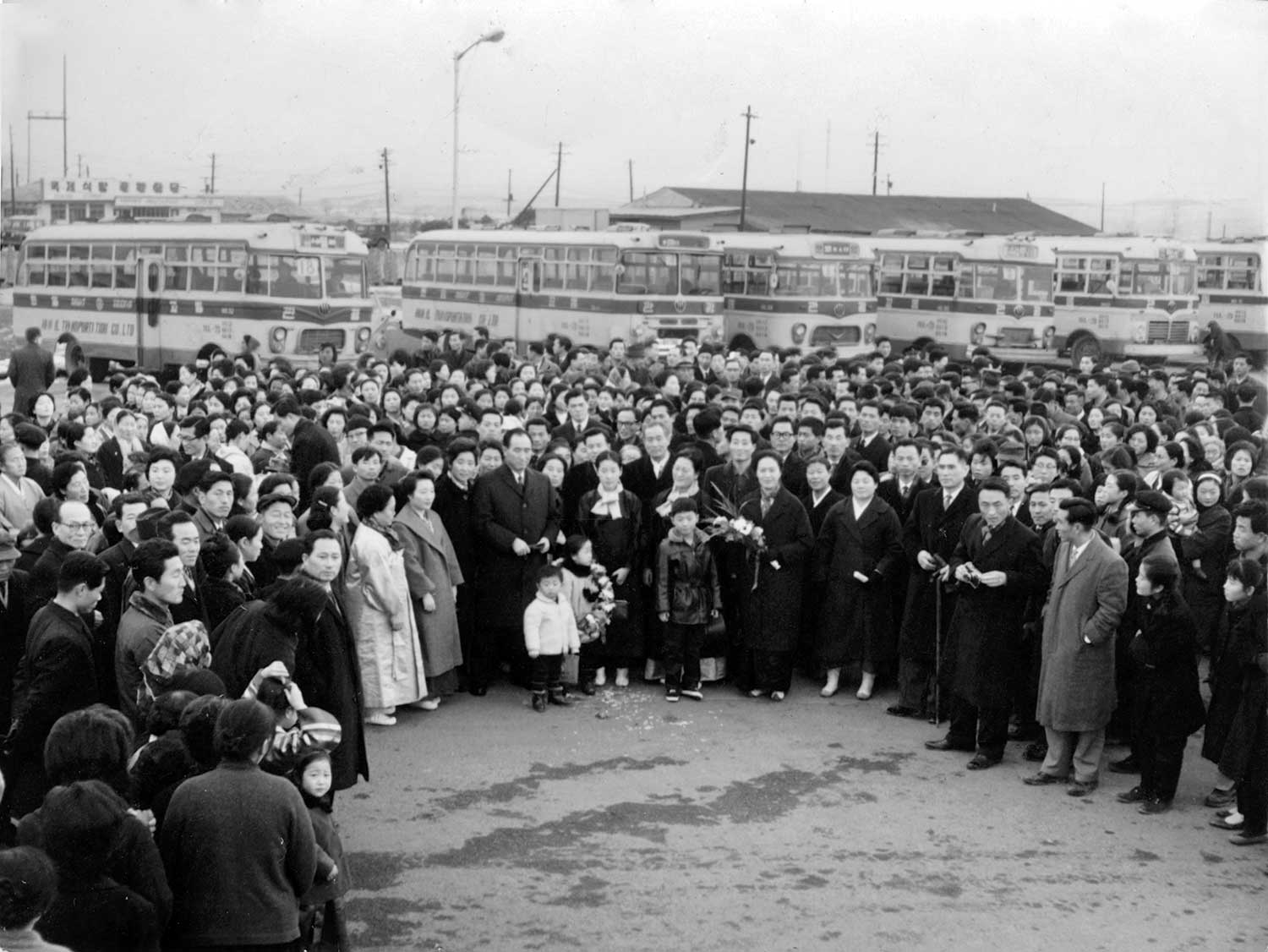 A crowd of well-wishers see True Parents off on their first world tour on January 28, 1965.