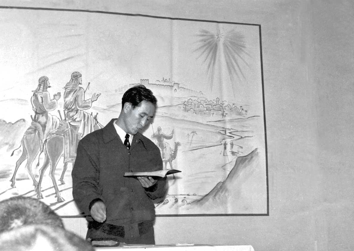 Father leads a holy song on Wednesday, January 2, 1957