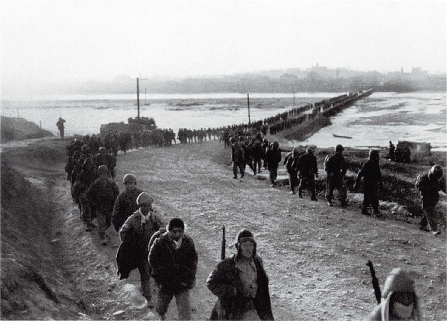 UN Forces cross the Taedong River on December 4, 1950, during their evacuation of Pyongyang, which they had held for forty-five days;